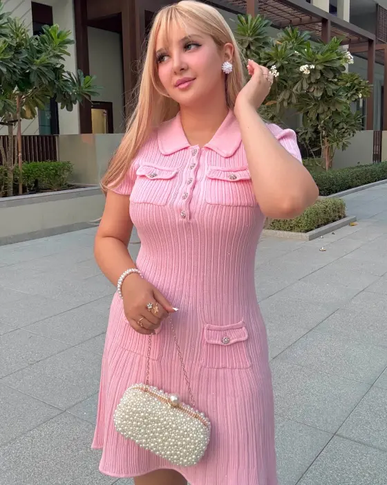 Romaisa wearing the pink dress