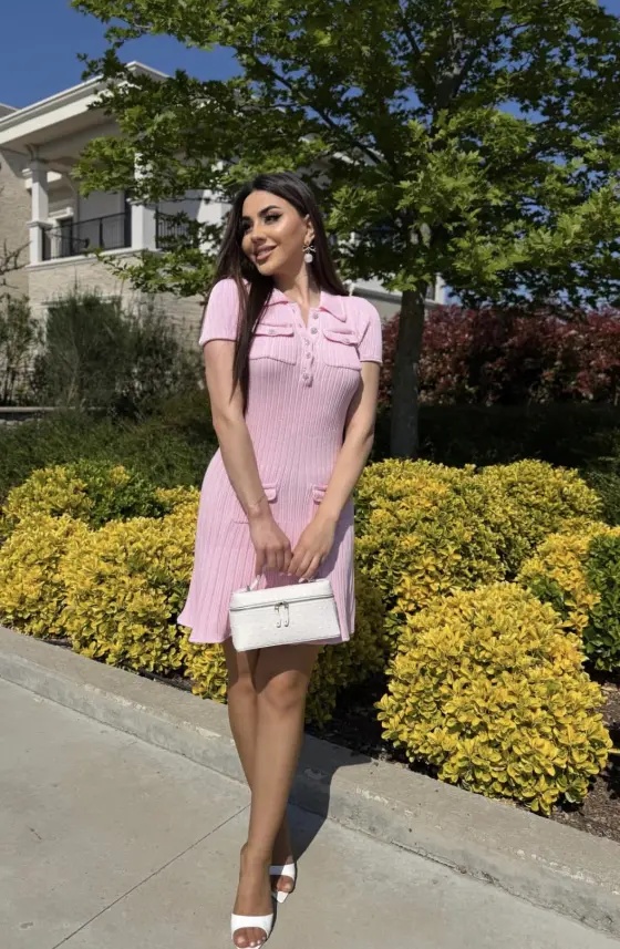 Nour wearing the pink dress